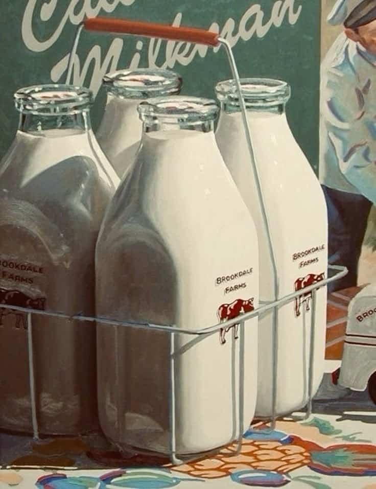 Vintage milk bottles in a metal carrier, labeled Brookdale Farms, evoke nostalgic dairy delivery scenes.