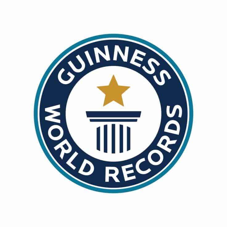 Guinness World Records logo featuring a column and star in a blue circle.