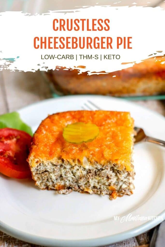 Crustless cheeseburger pie slice on a plate, garnished with a pickle, beside sliced tomatoes. Low-carb and keto-friendly.