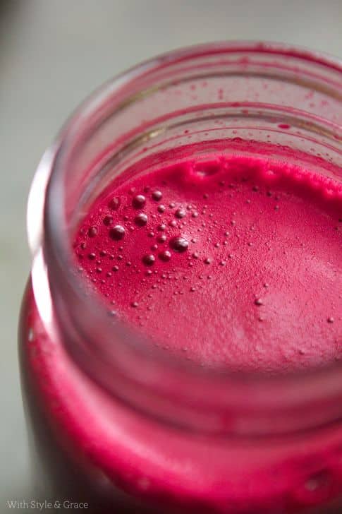 Vibrant beet juice in a glass jar, showcasing a fresh and healthy beverage option.