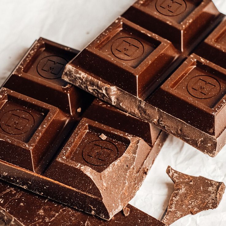 Close-up of rich, dark chocolate bars with distinct markings.