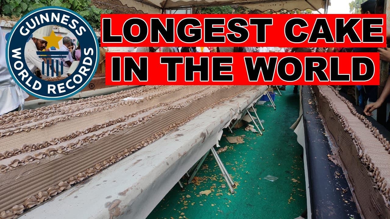 World's longest cake with Guinness World Records logo, showcasing a massive decorated dessert table.