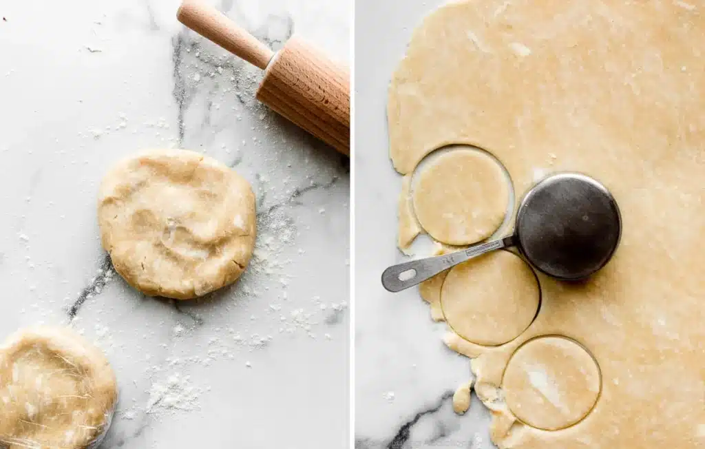 Preparing pie crust dough with rolling pin and biscuit cutter on a floured marble surface.