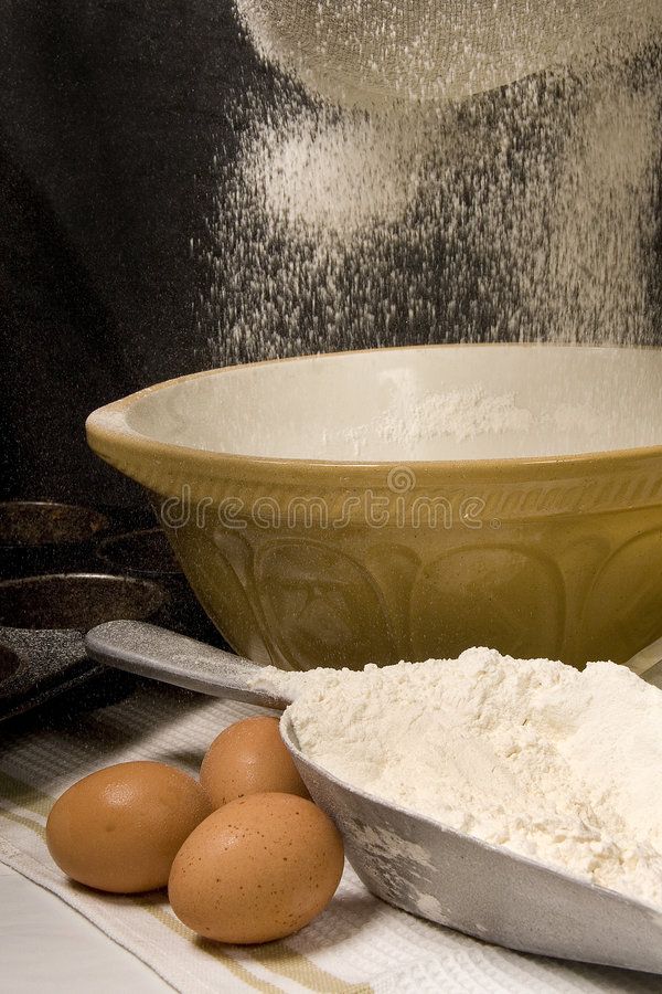 Baking essentials: eggs and flour with a large mixing bowl, perfect for bread and pastry preparation.
