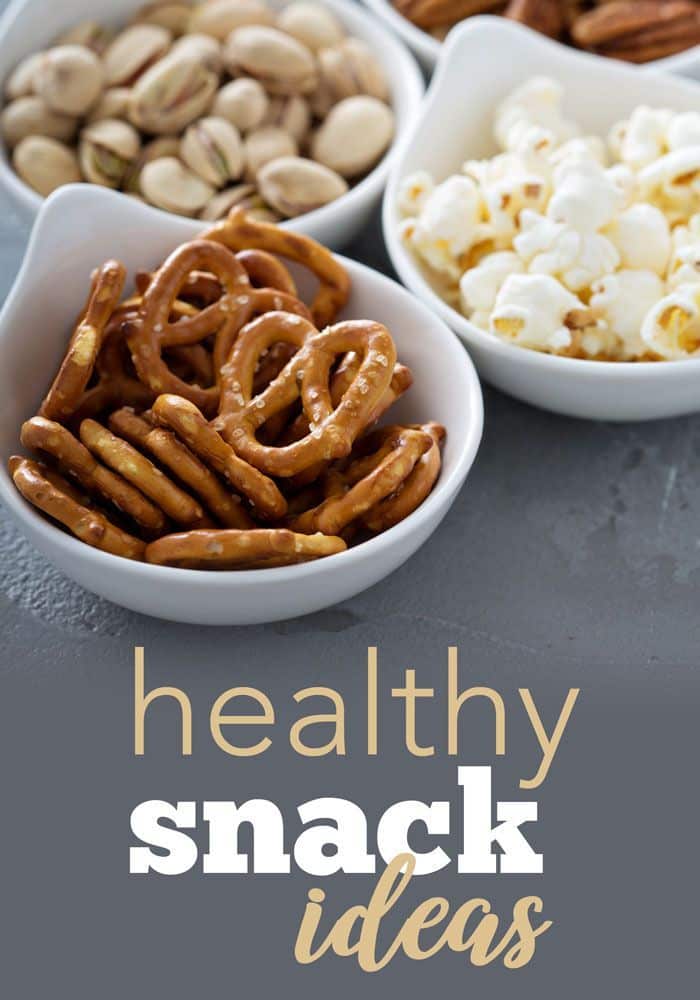 Bowls of healthy snacks: pretzels, pistachios, and popcorn, promoting nutritious snack ideas.