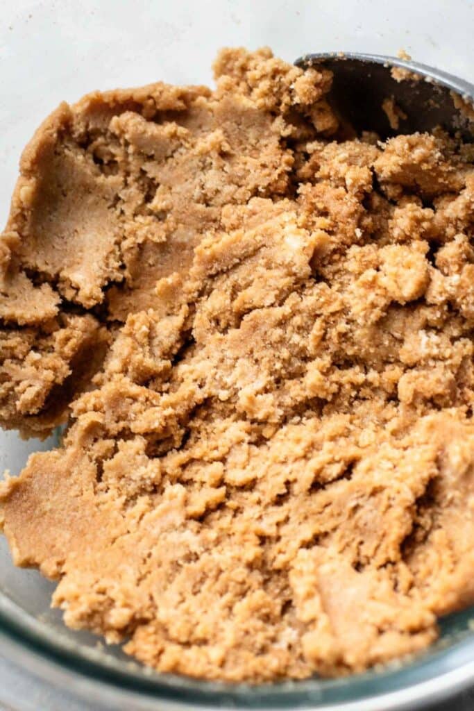 Close-up of homemade cookie dough in a bowl, perfect for baking fresh cookies.