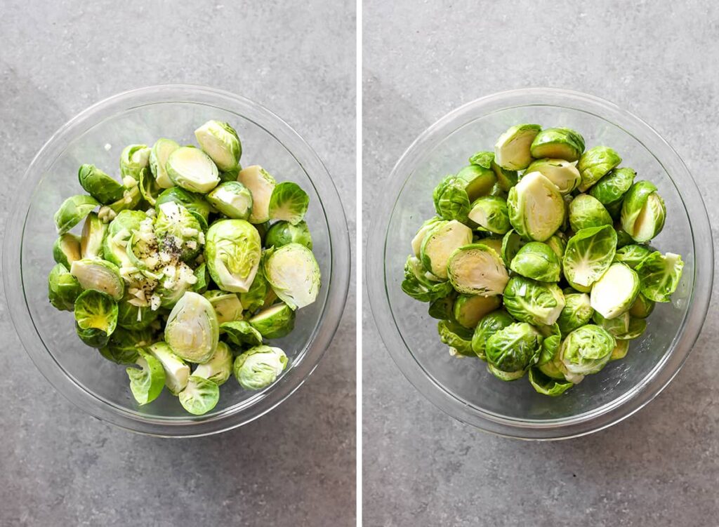 Two glass bowls of fresh, halved Brussels sprouts. One includes seasoning with garlic and pepper. Gray countertop background.