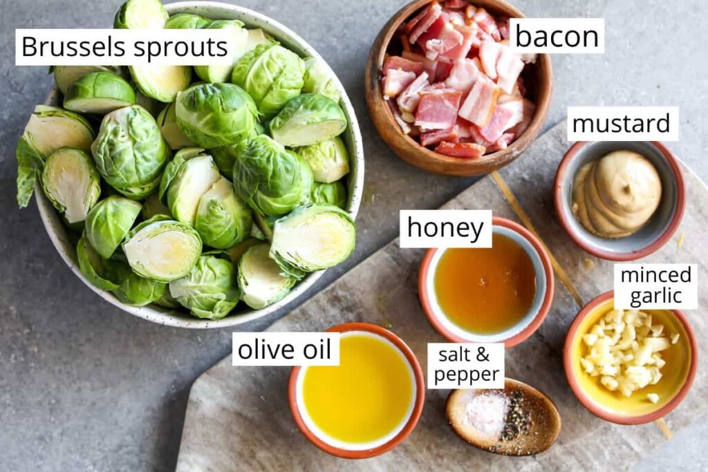 Ingredients for Brussels sprouts recipe: fresh Brussels sprouts, olive oil, honey, bacon, mustard, minced garlic, spices.