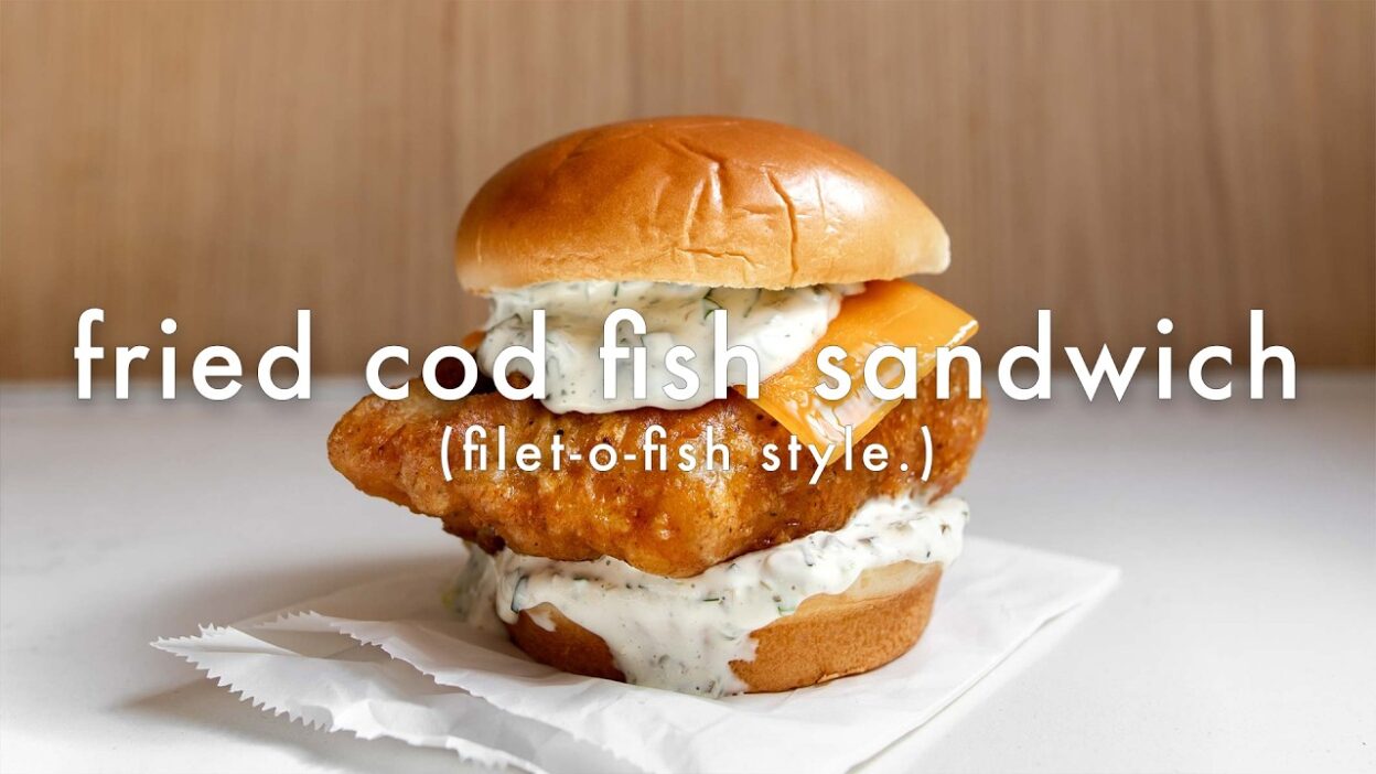 Fried cod fish sandwich with tartar sauce and cheese on a bun, Filet-O-Fish style.