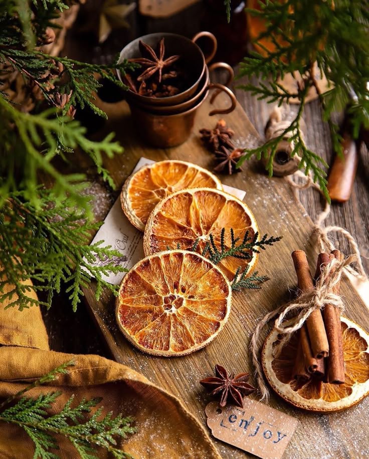 _ - 2026-01-11T140729319 - Elegant Winter Dessert: Perfect Mulled Wine Poached Pears Dried orange slices with star anise and cinnamon sticks on wood, surrounded by green branches and rustic decor.