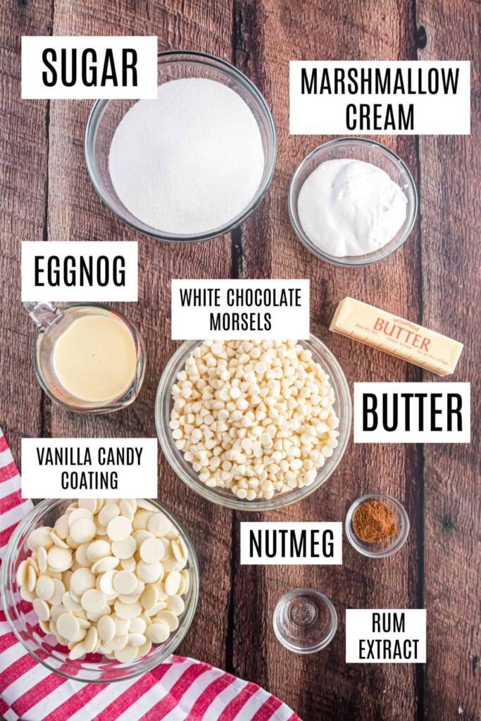 Ingredients for eggnog fudge: sugar, eggnog, butter, white chocolate, marshmallow cream, nutmeg, vanilla candy, rum extract.